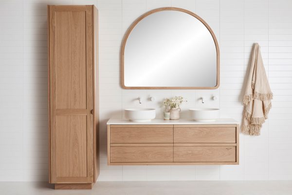 Shaker door profile timber tallboy, wall hung timber vanity and timber frame mirror in a coastal bathroom