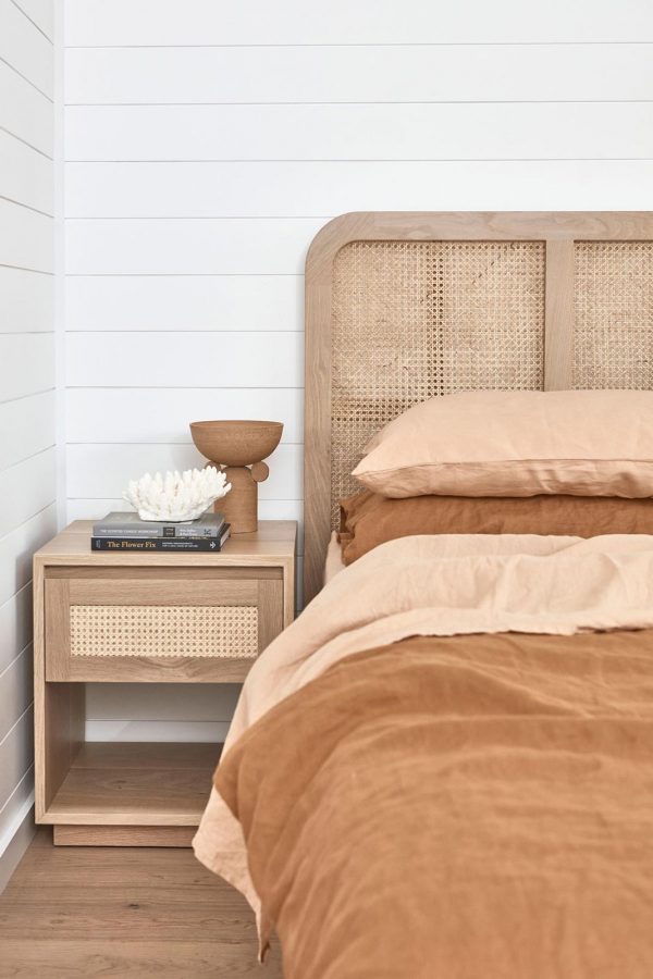 Pacific Bedside tables alongside a bed with timber headboard