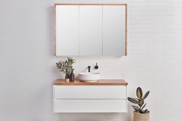 Mirrored bathroom cabinet over a timber vanity | Storage solutions for a coastal bathroom | Staples range