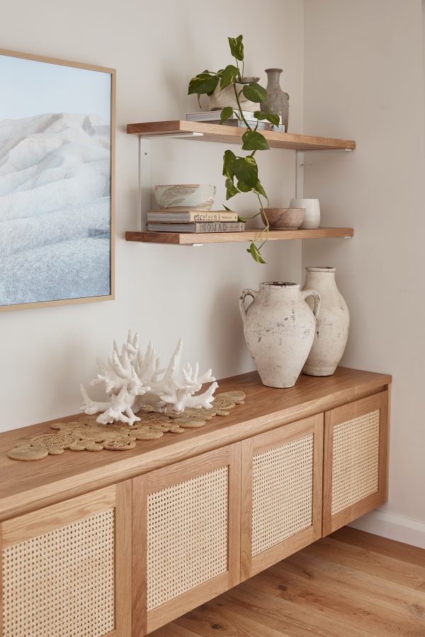 Timber Shelf with two shelves on the wall above a timber entertainment unit. All styled with a coastal interior design.