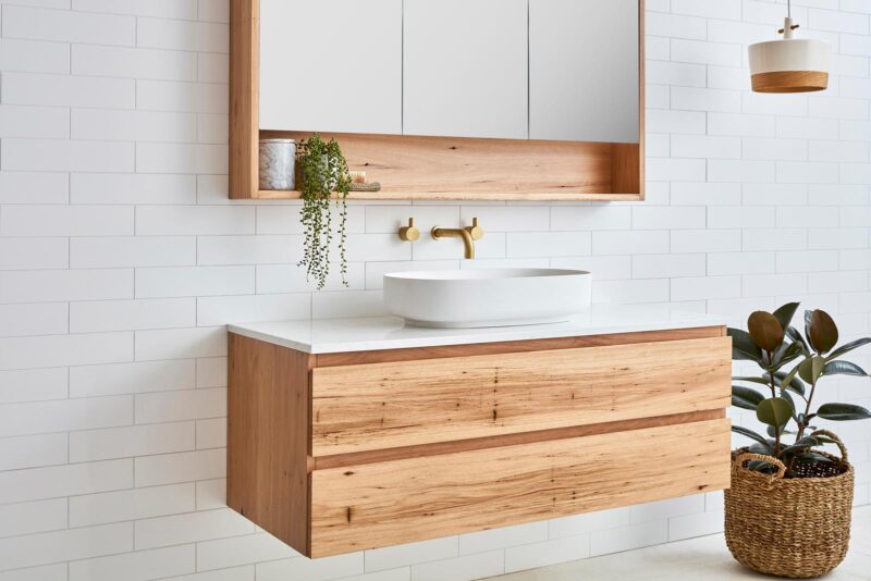Wall hung solid timber vanity with white sink for a coastal style bathroom.