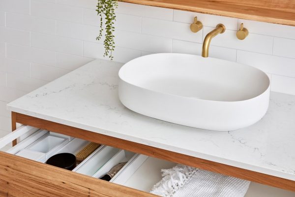 Wall hung solid timber vanity with white sink for a coastal style bathroom | Eden oval sink.