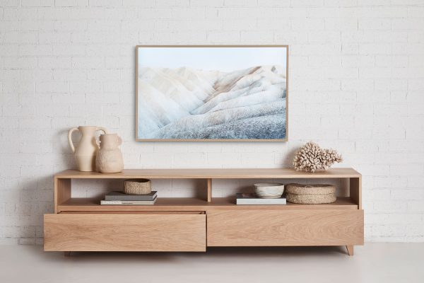 Styled for a coastal interior the Norah Entertainment unit if fresstanding, made with American Oak timber and has open shelving and two lower drawers