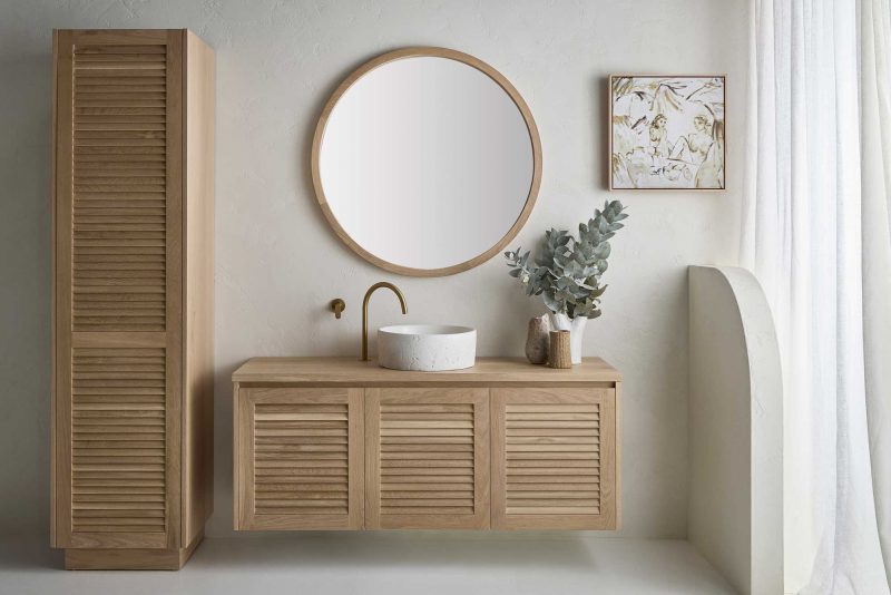  Keys Vanity and matching Keys Tower featuring beautifully crafted louvre door and Alura Round Mirror all in American Oak Light