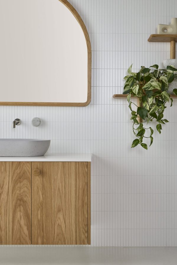 This bathroom vanity is wall hung and set in a coastal setting