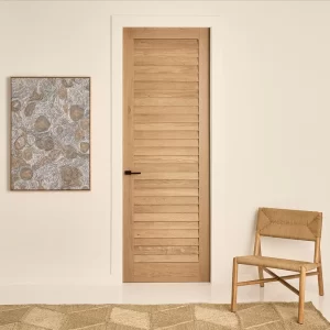 Internal door in timber with louvre panel finish