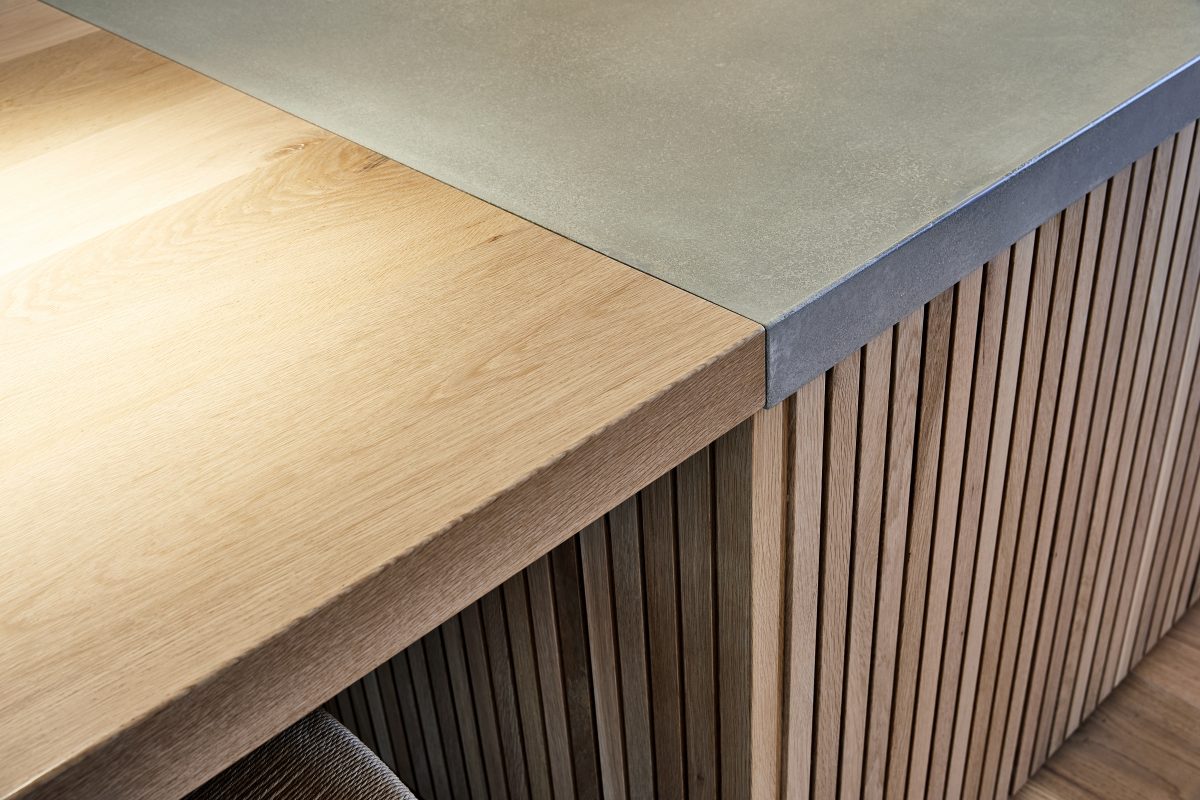 Timber benchtop connecting to a concrete bench top